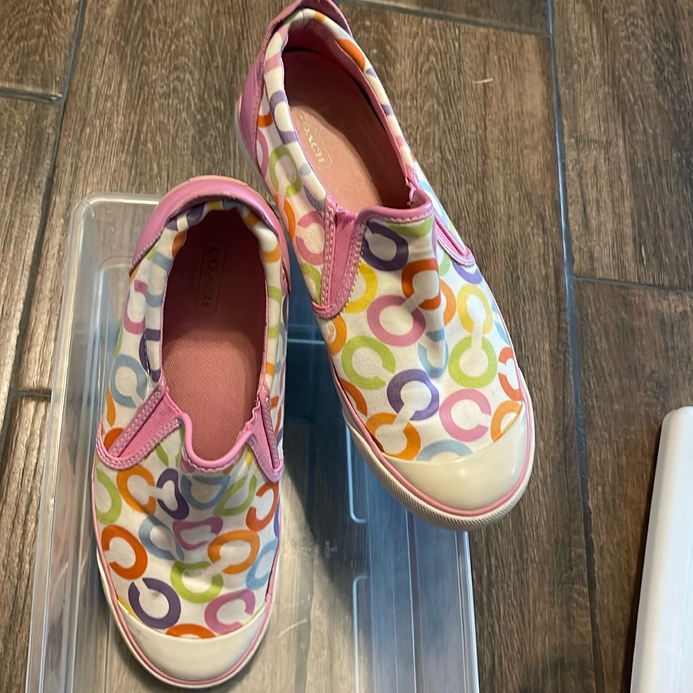 Brightly colored Coach slip ons